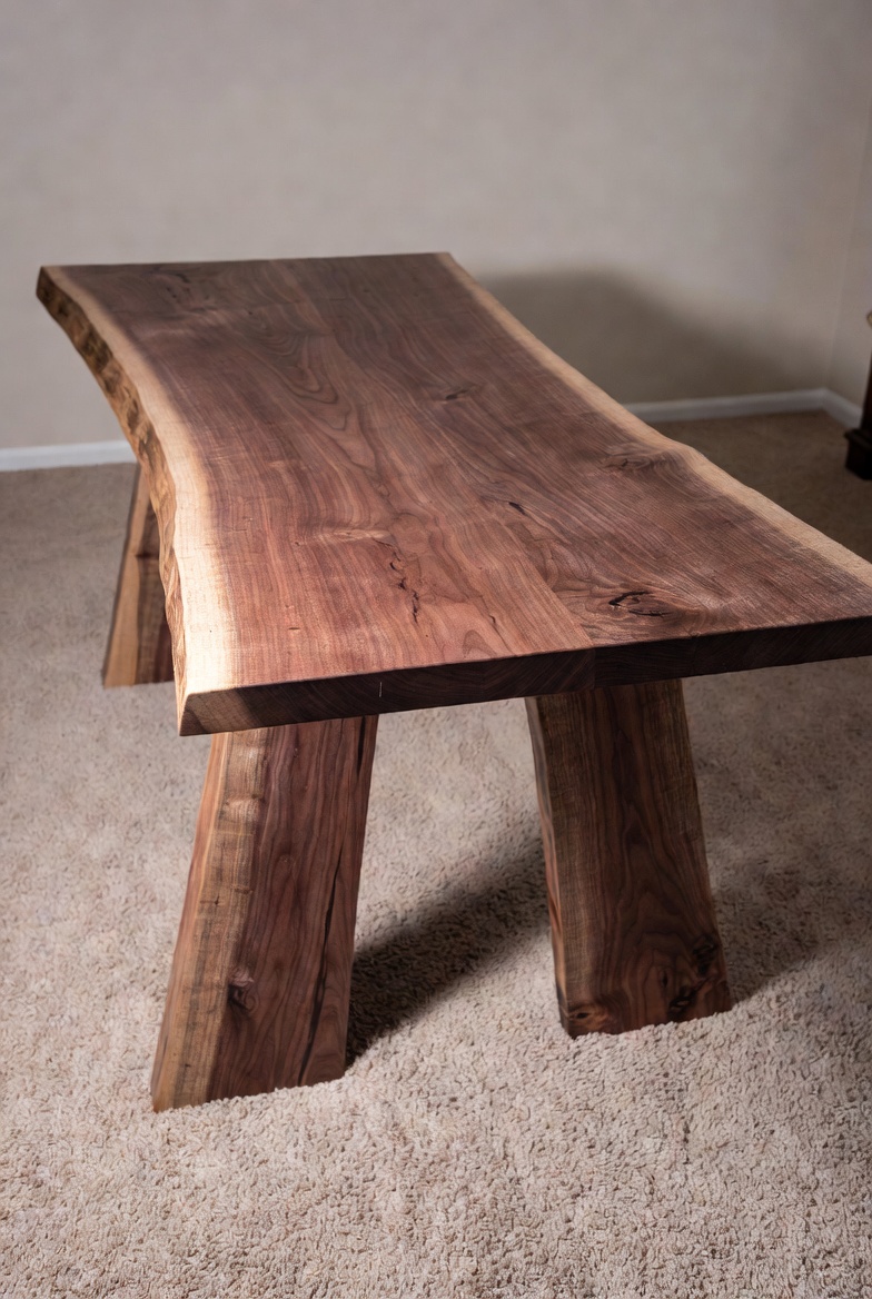 Handcrafted walnut dining table with live edge
